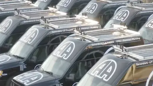Double A - Home of the AC Bee's trucks in a row
