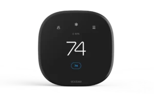 Modern smart thermostat displaying 74 degrees Fahrenheit.