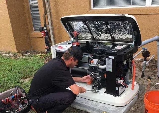 Technician repairing an outdoor air conditioning unit.